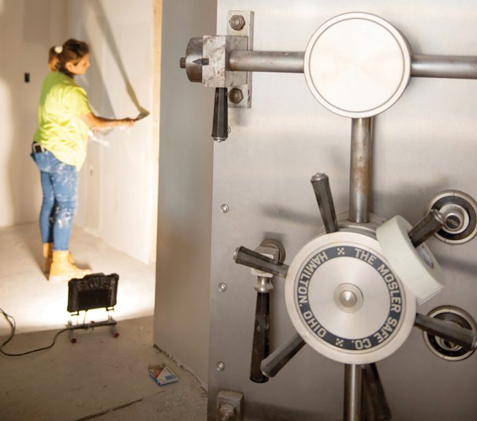 MOVING IN:
Construction worker Fabiola Roman installs drywall at a new Bank Rhode Island branch in Newport in 2023. The bank is now called Beacon Bank. Several smaller banks expanded their branch networks in Rhode Island over the last five years, while bigger financial institutions shuttered some of their branches.
PBN FILE PHOTO/DAVID HANSEN MOVING IN:
Construction worker Fabiola Roman installs drywall at a new Bank Rhode Island branch in Newport in 2023. The bank is now called Beacon Bank. Several smaller banks expanded their branch networks in Rhode Island over the last five years, while bigger financial institutions shuttered some of their branches.
PBN FILE PHOTO/DAVID HANSEN