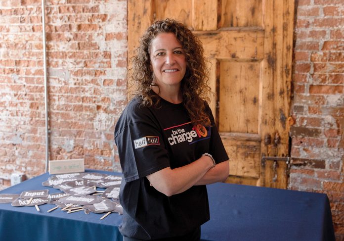 Leading With Vulnerability: Rebecca Twitchell, founder and president of Half Full LLC, has spent 21 years living her “do well, do good” motto, growing the company via its acquisition of Advancing Workplace Excellence and giving back.  PBN PHOTO/TRACY JENKINS