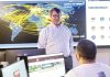 A DIFFERENT CLASSROOM: Douglas S. Alexander, director of the Institute for Cybersecurity & Emerging Technologies at Rhode Island College, speaks with RIC senior Miled Kalbourji in the institute’s cyber range classroom in 2025.  COURTESY RHODE ISLAND COLLEGE