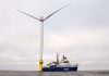 Offshore wind sector hits turbulence BACK AT IT:
An Orsted A/S vessel is docked to one of the massive wind turbines off the coast of Rhode Island. Work on the turbines was delayed because of Trump administration orders, but it has resumed after the courts stepped in.
AP FILE PHOTO/JOSHUA A. BICKEL