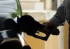 THE AVERAGE weekly price of self-serve, regular unleaded gasoline in Rhode Island decreased 11 cents to $3.96 per gallon, AAA Northeast said Tuesday. / AP FILE PHOTO/NAM Y. HUH