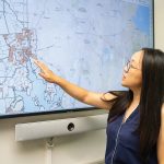 Dollar stores and diet the focus of URI-led study SPREADING OUT: University of Rhode Island public health professor Wenhui Feng examines a map of dollar stores in Rhode Island, most of them concentrated in urban areas. Feng is leading a new study on dollar stores and the food that is purchased there.
PBN PHOTO/STEPHANIE BERNABA