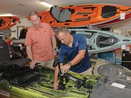 BETTER THAN MOST: Matt ­Bosgraaf, right, owner of the Kayak Centre in North Kingstown, says inflation and other economic challenges have not stopped his business from growing.  PBN FILE PHOTO/­ELIZABETH GRAHAM