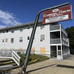 BOARDS COVER the windows of the Gabriel House assisted living facility in Fall River, where a fire in July 2025 killed several people in Fall River. Thirty-nine plaintiffs affected by the fire have united their lawsuits into one master complaint. / AP FILE PHOTO/KIMBERLEE KRUESI