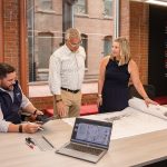Shawmut doubles revenue in two years CONSTRUCTION CONVERSATION: Chris Maury, left, head of Rhode Island operations and head of preconstruction for the New England region; Gordon Zaniol, center, project executive; and Kristine Kennedy, senior project manager, discuss a project at Shawmut Design and Construction.
PBN PHOTO/TRACY JENKINS