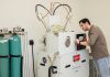 Breath analysis: Trace Sensing Technologies’ flagship platform, TRACE-E, uses patented thermodynamic sensor technology to detect molecular biomarkers in exhaled breath, improving disease detection. Peter Ricci III, founder and CEO, works on the machine.  PBN PHOTO/TRACY JENKINS