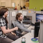 AI-Driven Growth: Warwick tech firm Vertikal 6 is growing through artificial intelligence and cybersecurity work. From left, Joe Sabala, field services technician, and Jared Ducharme, escalation team lead, at Vertikal 6. PBN PHOTO/TRACY JENKINS