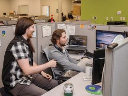 New system, staff training key to Vertikal 6’s rise AI-Driven Growth: Warwick tech firm Vertikal 6 is growing through artificial intelligence and cybersecurity work. From left, Joe Sabala, field services technician, and Jared Ducharme, escalation team lead, at Vertikal 6.
PBN PHOTO/TRACY JENKINS