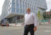 MORE NEEDED: Bob Cormier, CEO and president of the R.I. Life Science Hub, is looking for significantly more state investment in the promising life sciences sector. He stands here outside Brown University’s life sciences building in Providence’s Jewelry District.  PBN FILE PHOTO/­ELIZABETH GRAHAM