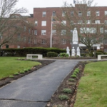 NEW PLAN? Questions remain about the five-year strategic plan for Our Lady of Fatima Hospital, pictured above, and Roger Williams Medical Center. / PBN FILE PHOTO/MICHAEL SALERNO