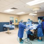 Learn and earn: The high-fidelity simulation surgical space at the New England Institute of Technology’s East Greenwich campus, developed alongside Brown University, allows students to operate digitally on a body. This technology is used in NEIT and Brown University Health’s registered apprenticeship program to provide students a pathway into surgical technology while remaining employed. COURTESY NEW ENGLAND INSTITUTE OF TECHNOLOGY