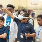 SEED TO STEM: Fifth and sixth grade students at Times2 STEM Academy in Providence use virtual reality stations at the Ocean Technology and Engineering Lab.  COURTESY COURAGE BUILDER