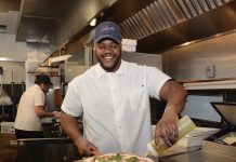 KITCHEN DREAMS: High turnover leaves culinary jobs plentiful CHEERFUL CHEF: Cedrick Almonacy, sous chef at Celeste restaurant in Narragansett, puts the finishing touches on a pizza. Almonacy said he has enjoyed cooking since childhood.
PBN PHOTO/ELIZABETH GRAHAM