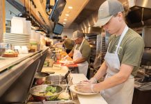 Recipe for success: Tyler Gill, foreground, splits his time between working at the J.T. Commons restaurant in Middletown with his classes at the Community College of Rhode Island.  PBN PHOTO/STEPHANIE BERNABA
