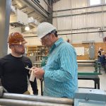 Heavy Metal: Instructor John Kousa, right, works with a student on fabricating a section of ventilation ductwork for a submarine mock-up at the Westerly Education Center.  COURTESY R.I. OFFICE OF THE POSTSECONDARY COMMISSIONER/BETH BAILEY