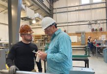 Heavy Metal: Instructor John Kousa, right, works with a student on fabricating a section of ventilation ductwork for a submarine mock-up at the Westerly Education Center.  COURTESY R.I. OFFICE OF THE POSTSECONDARY COMMISSIONER/BETH BAILEY