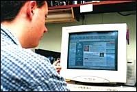 This teenager clicks on via<br>America Online. This teenager clicks on via<br>America Online.