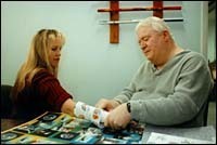 Demonstrating an illustrated splint<br>is Barbara Calise with Robert Coffey,<br>owner Demonstrating an illustrated splint<br>is Barbara Calise with Robert Coffey,<br>owner