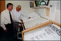 The owner and the estimator,Mark Shovelin, left, and MichaelWintle look at some plans. The owner and the estimator,<br>Mark Shovelin, left, and Michael<br>Wintle look at some plans.