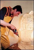 Shaping an Easter basketin ice is Louis Manzoni atArt in Ice, Inc.(Brian MacDonald) Shaping an Easter basket<br>in ice is Louis Manzoni at<br>Art in Ice, Inc.<br>(Brian MacDonald)