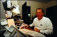 Home in his office, Neal Hannon,Bryant College accounting professor.(Tom Croke) Home in his office, Neal Hannon,<br>Bryant College accounting professor.<br>(Tom Croke)