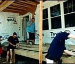 Students from Woonsocket Career andTechnical Center work on an energylean home. (Al Alexio)