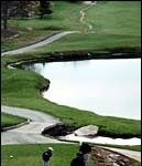 Jacketed to fendoff chill, eager golfersprepare to play.(Al Alexio)