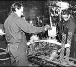 Economy entering a new, uncertain cycle Ed Weidele and Brian Bowser shape acustom made leaf at Palmer Spring.(Tom Croke)