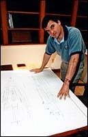 Jean Pierre Moulignewith sailboat plans.(Al Alexio) Jean Pierre Mouligne<br>with sailboat plans.<br>(Al Alexio)