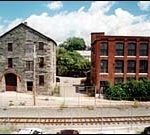 Among the 40 surviving mills inWoonsocket are the two above.(Brian McDonald)