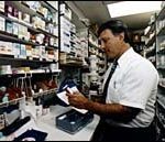 Pharmacist at work is RichardBacker at East Side PrescriptionCenter. (Tom Croke)