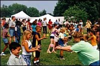 Bank RI employees and theirfamilies toss water balloons atTwelve Acres in Smithfield. Bank RI employees and their<br>families toss water balloons at<br>Twelve Acres in Smithfield.