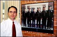 Bureau chief, Ben Lupovitz, VPand CEO, with picture ofearly officers. (Al Alexio) Bureau chief, Ben Lupovitz, VP<br>and CEO, with picture of<br>early officers. (Al Alexio)