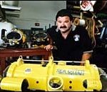 Underwater, their work skills are tops With an underwater camera device is Nick Tanionos, an owner of Specialty Diving Services, Inc.