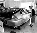 Environment, thrift fuel hybrid cars’ appeal Anne Greening checks the sticker atHerb Chambers Honda in Seekonk.