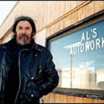 Al Mandell in front of his East Providence garage.