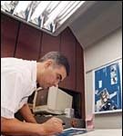 Small business takes the cautious route; wary response to economy Rui Azevedo of Docu-Print checks the quality of production.