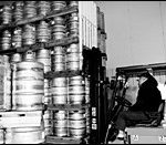 A forklift operator stacks kegs of beerat McLaughlin & Moran in Cranston.
