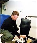 Eric Wiitala works on a pump at Atlantic Aquaculture.