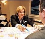 Concierge Meredith Reid offers someadvice to a guest at the NewportMarriott.