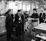 Group from Egypt talks with an employee at Eastern Butcher Block.