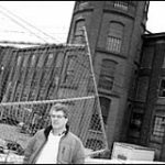 Outside Atlantic Mills in Olneyveille stands Frank Shea of the housingcorporation