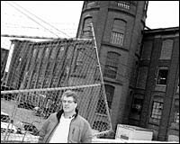 Outside Atlantic Mills in Olneyveille stands Frank Shea of the housingcorporation Outside Atlantic Mills in Olneyveille <br>stands Frank Shea of the housing<br>corporation