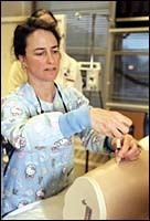 RI hospitals turn to ex-nurses, offer retraining Mary Oliphant, RN, usesa syringe in retraining classat Fatima Hospital.