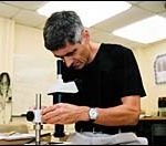 Keeping track of salmon with URI’s help Godi Fischer examines a microchip.
