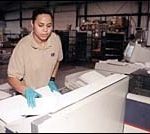 Postage hike hitting nonprofits, small business hard Worker at Mail Processing Concepts in East Providence.