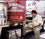 For truckers, the ‘good times’ are a memory Checking his manifest is David Russo of Russo Trucking.