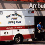 Lifespan’s fiscal condition improving East Providence rescue truck crew and patient at entrance to RhodeIslandHospital emergency room.