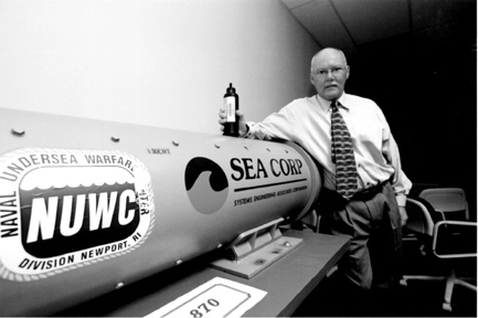 SEA Corp. president Brian Gilligan holds a cartridge used in launchingtorpedoes or auto airbags. SEA Corp. president Brian Gilligan holds a cartridge used in launching<br>torpedoes or auto airbags.