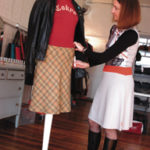 For clementine, a Broadway opening Annie Atherton, owner of clementine,adjusts a clothing display.